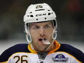 Buffalo Sabres' Thomas Vanek chews on his mouth guard during the third period of the NHL hockey game against Los Angeles Kings in Berlin, October 8, 2011. (REUTERS/Thomas Peter)