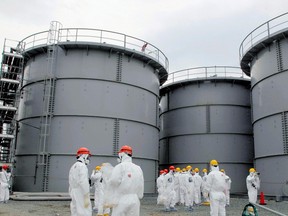Tanks of radiation-contaminated water are seen at the Tokyo Electric Power Co.'s tsunami-crippled Fukushima Daiichi nuclear power plant in Fukushima prefecture in this file photo released by Kyodo on March 1, 2013. (REUTERS/Kyodo/Files)