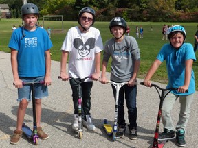 Tyson DeCloet, Keiran Nealon-Rice, Lucas Deutsch and Gavin Nold scooter in the Monsignor O'Neil Terry Fox Run. Contributed Photo by Jennifer Van Acker-Barlow