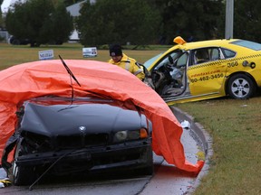 Police at the scene of a crash that left one man fighting for his life in hospital, early Oct. 2, 2013. (PERRY MAH/EDMONTON SUN)