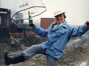 David Garrick celebrates after the building permit for the SkyDome was issued by the City of Toronto on Sept. 12, 1985. The dome opened 40 months later. The umbrella says "The Dome" as it had not been named yet.