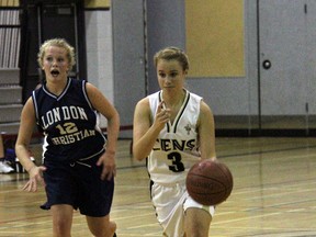 Holy Cross point guard Megan Van Kessel carries the ball up the court during a 32-23 win over London Christian in TVRA senior girls London District action October 2, 2013. The Cens are adjusting to the new league landscape, one that will see them play many powerhouse catholic teams during the regular season.
JACOB ROBINSON/AGE DISPATCH/QMI AGENCY