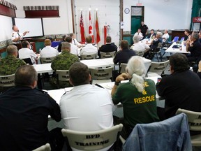 JEROME LESSARD The Intelligencer
Robert Rutter, left, chairman of the Hastings and Prince Edward Counties Mutual Fire Aid Association and deputy chief of Prince Edward County Fire Department, speaks during the association's meeting held at Quinte Exhibition Fairgrounds in Belleville Wednesday evening.