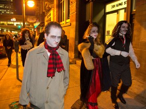 Matthew Stewart plays Bulent Burymore accompanied by Dave Adler (Leofric Burymore) and Megan Muldoon (Hermalinda Burymore) during a dress rehearsal for the ninth edition of the Lost Soul Stroll that starts Friday and continues through October in downtown London. (MIKE HENSEN, The London Free Press)