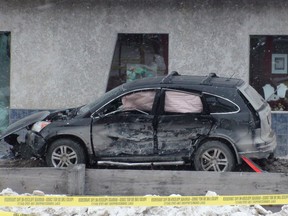 A woman was killed in this Feb. 15 crash near the corner of Balmoral Street and Notre Dame Avenue. On Thursday, the driver of this Honda CR-V received a 6.5-year jail sentence for the drunken hit-and-run. (RICH POPE/WINNIPEG SUN FILE PHOTO)
