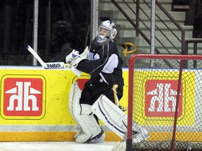Sarnia Sting goaltender Taylor Dupuis works on outlet passes at practice on Oct. 3. Sarnia travels to Kitchener on Friday, Oct. 4 to take on the Rangers and try to get back into the win column. (SHAUN BISSON, The Observer)
