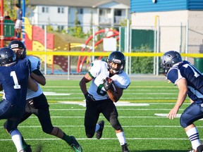 Running back Quinn Polley, seen here dodging Ross Shep players in a recent game, has gone over the 1,000-yard mark in just four games, with last week’s 397-yard performance against Salisbury. - Thomas Miller, Reporter/Examiner