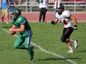 St. Patrick's quarterback Josh Ellesley finds a hole and breaks up field for a first down on a quarterback keeper in the first quarter, Friday Oct. 4. The Irish would end up losing the game 28-0. (SHAUN BISSON, The Observer)