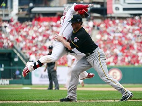 St. Louis Cardinals shortstop Daniel Descalso is tagged out by Pittsburgh Pirates relief pitcher Tony Watson during Game 2 of their National League Divisional Series at Busch Stadium in St. Louis, Oct. 4, 2013. (SCOTT ROVAK/USA Today)