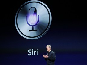 CEO Tim Cook talks about Siri during an Apple event in San Francisco, California March 7, 2012.  (REUTERS/Robert Galbraith)