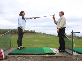 Golf pro John Colwell instructs LCVI student Heather Richardson, 16, at a clinic Friday afternoon at Belle Park Fairways.
Elliot Ferguson The Whig-Standard