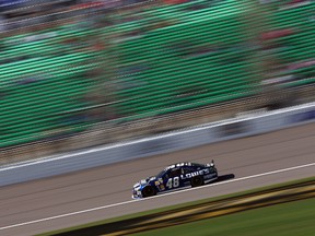 Jimmie Johnson, driver of the #48 Lowe's Chevrolet, practises for the NASCAR Sprint Cup Series 13th Annual Hollywood Casino 400 at Kansas Speedway on Saturday, Oct. 5. (Getty Images/AFP)