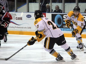 Sarnia forward Matteo Ciccarelli passes the puck to teammate Jeff King during the second period of action between the Sting and Niagara IceDogs on Saturday, Oct. 5. The Sting earned a single point in a 4-3 shootout loss. SHAUN BISSON/THE OBSERVER/QMI AGENCY