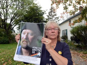 Patti Stirling holds a photo of her brother Paul Ruzycki in front of her Port Colborne, Ont. home Wednesday, Oct. 2, 2013.
DAVE JOHNSON/QMI Agency