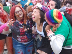In this file photo, a zombie horde overwhelmed this young woman just before the Sudbury Zombie Walk got underway.