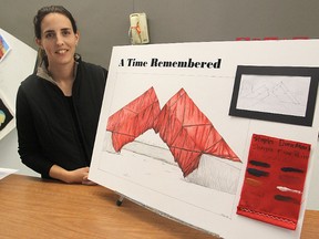 Frontenac Secondary School teacher Erica Robinson with an artist’s image of a project she hopes her arts students can carry out next year: wrapping the Time sculpture in a poppy-red material to mark Remembrance Day and the 100th anniversary of the start of the First World War. (Michael Lea The Whig-Standard)