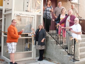Elgin Theatre Guild toasts long-awaited completion of accessibility elevator at Princess Avenue Playhouse in time for Thursday's Sloan concert and next week's community theatre season opening. Dave McCormick, ETG director in charge of facilities, and Lesley Chapman, ETG president, are at ground level. Chris Chapman Contributed