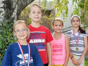 Upper Thames elementary school division winners from the Patrick Cook Memorial Run Oct. 1 were Erika Lealess (left), Will Korver, Alyssa Eidt and Avery Anderson. The foursome led a strong UTES contingent. KRISTINE JEAN/MITCHELL ADVOCATE