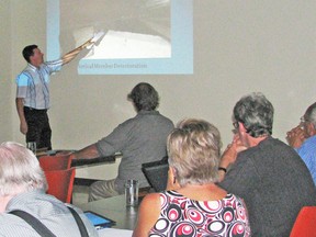 Ryan Munn of B.M. Ross & Associates provides information to the joint members of the West Perth and Perth South councils Oct. 1 at the municipal office in Mitchell. KRISTINE JEAN/MITCHELL ADVOCATE