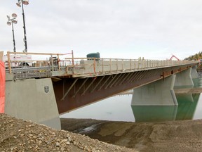 Due to flooding in June and some slides experienced in the construction site, work on the bridge project has been put behind schedule.