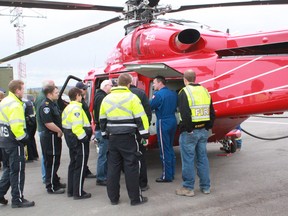 Pilot Andre Rioux ( in blue) shows Whitecourt emergency responders the features of the AW 139, the newest air amulance craft to the STARS fleet on Monday, Sept. 30.
Celia Ste Croix | Whitecourt Star