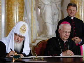 Archbishop Jozef Michalik (right) has landed himself in trouble with the church after he said children of divorced parents were more likely to be sexually abused by priests. 

Kacper Pempel/REUTERS