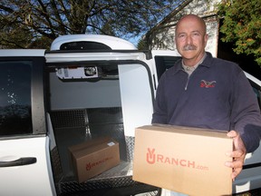 YU Ranch has been recognized by Premier Kathleen Wynne’s office for its hybrid gas/electric freezer delivery mini-van known as the ‘Farmer's Market Express.’ Here, Bryan Gilvesy illustrates the operational interior of the converted Dodge Caravan at their Tillsonburg-area property. Jeff Tribe/Tillsonburg News