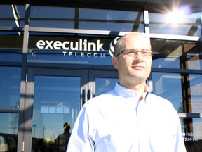 Ian Stevens, CEO of Execulink Telecom, stands in front of the company's new head office on Ridgeway Road in Woodstock on Tuesday.  (CODI WILSON, Sentinel-Review)