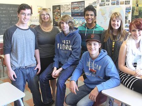 With Frontenac Secondary School teacher Nicole Kasserra, second from left, are some of the students who wrote letters to veterans and current soldiers and just received a reply back from Afghanistan. They are, from left, Ryan Crawford, Ben Rosebery, Nikhil Vyas, Mikayla Sebesta, Mallory Davis and, seated, Mike Yates. (Michael Lea The Whig-Standard)