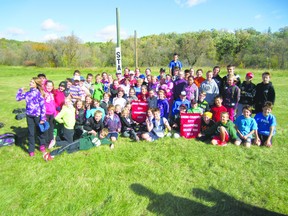 Ecole Arthur Meighen School celebrates its overall win at the city cross-country championships Oct. 1.  (Submitted photo).