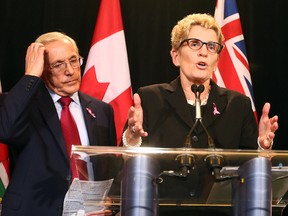 Energy Minister Bob Chhiearelli, left, and Premier Kathleen Wynne answer questions at Queen's Park after Auditor General Bonnie Lysyk's damning Oct. 8 report on the cost of cancelling the Oakville gas plant.
DAVE ABEL/TORONTO SUN