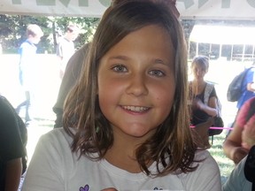 Georgia Van Louwe bravely displays a snake at the Carolinian Forest Festival. Contributed Photo By Jennifer Van Acker-Barlow