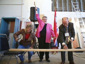 Mary Margaret Dauphine of Independent Living Centre Kingston, centre, celebrates the start of renovations of a new Home Base Housing facility 
along with HBH board president Bill Dobson and Kingston city councillor Sandy Berg. (Elliot Ferguson The Whig-Standard)