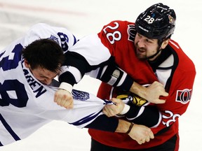 Ottawa Senator's Matt Kassian (28) fights Toronto Maple Leafs' Frazer McLaren (38) during first period of NHL hockey action at Scotiabank Place Saturday, April 20, 2013.  Darren Brown/Ottawa Sun/QMI Agency