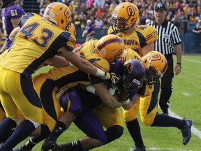 The Queen's Golden Gaels, in action against the Wilfrid Laurier Golden Hawks last weekend, travel to Waterloo to play the Warriors Friday night. (Elliot Ferguson/The Whig-Standard)