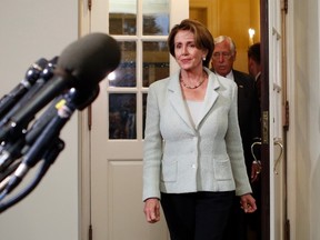 U.S. House Minority Leader Nancy Pelosi exits the White House to speak to reporters after a meeting between House of Representatives Democrats and U.S. President Barack Obama in Washington October 9, 2013. (REUTERS/Kevin Lamarque)