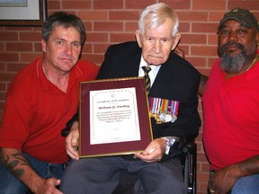 Bill Findley, St. Thomas, holds a deputy minister's commendation from Veterans Affairs Canada for his support of the Operation Stress Injury Social Support program. He's flanked by Michael Newcombe, left, Department of National Defence OSSIS peer support coordinator at Parkwood Hospital, and veteran Cory Hibbert.