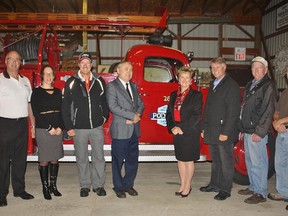 Officials with LANXESS were recently on hand at the Moore Museum to donate a 1946 fire pumper for display. Pictured are, from left, Bruce Morris, LANXESS fire chief, Karen Genoway, manager of the Bioindustrial Park Sarnia for LANXESS, Pat Brown, LANXESS project coordinator, Jim Townsend, Moore Museum Advisory Committee chairperson, Bernie Taylor, public relations with LANXESS, Steve Arnold, St. Clair mayor, Jim DeGurse, St. Clair councillor, and Dave Talyor, a recent LANXESS retiree and a volunteer with the museum. 
HEATHER YOUNG/ SARNIA THIS WEEK/ QMI AGENCY