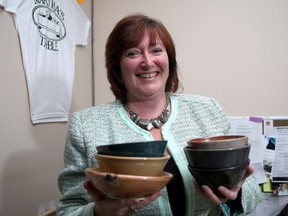 Ronda Candy, executive director of Martha's Table in Kingston with some bowls that will be used for their empty Bowls fundraising event on Sunday.  Ian MacAlpine The Whig-Standard