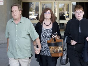 Christopher Gale?s mother, Sheila Lundy, closes her eyes as she leaves the London courthouse with her husband, Kevin Lundy. (CRAIG GLOVER, The London Free Press)