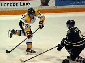 Sarnia Sting rookie forward Nikita Korostelev looks for a passing lane during the second period of the Sting vs. Knights game on Thursday, Oct. 10. The 16 year old has yet to register a goal in the OHL, but is extremely close to breaking through. (SHAUN BISSON, The Observer)