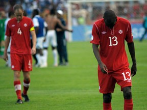 Canada's Kevin McKenna (L) and Atiba Hutchinson react after their team's loss against Honduras during their 2014 World Cup qualifying soccer match at the Olimpico Stadium in San Pedro Sula October 16, 2012. (REUTERS)
