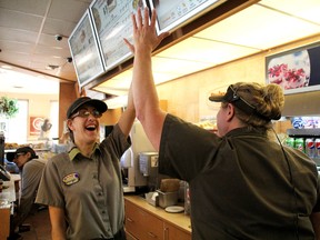 Kaitlyn Hill and her supervisor Trish Hanna always try to make work at a Tim Horton's in Sarnia fun. Hill was hired through the Rotary at Work program that helps individuals with special needs find jobs. MELANIE ANDERSON/THE OBSERVER/QMI AGENCY