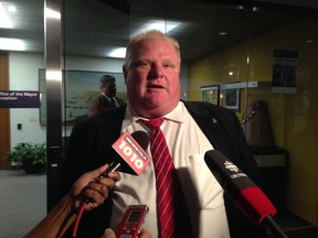 Toronto Mayor Rob Ford speaks to reporters at City Hall on Friday. (DON PEAT/Toronto Sun)