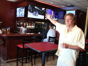 Martie McCarthy shows off the bar at his new restaurant in Sarnia's Sherwood Village. McCarthy's South Side Grill opened Thursday. TYLER KULA/ THE OBSERVER/ QMI AGENCY