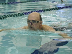 Don Holmes swims laps and raises money for his Swim for Hope fundraising campaign for the Cross Cancer Institute at the TransAlta Tri Leisure Centre on Oct. 7. Dedicating the funds raised to cancer research, Holmes began his campaign as a way to give back to the cancer institute. - Karen Haynes, Reporter/Examiner