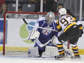 Kingston Frontenacs’ Sam Bennett puts the puck into the top left corner of the net past Sudbury Wolves goalie Troy Timpano during the first period of Friday night’s Ontario Hockey League game at the Rogers K-Rock Centre The Frontenacs won 10-1. (Michael Lea/The Whig-Standard)