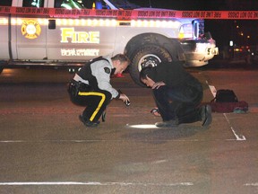 Members of the RCMP investigate a fatal collision between a bicyclist and a pickup truck on 51 Street on the evening of Thursday, Oct. 10. 
Barry Kerton | Whitecourt Star