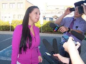 Julie Bilotta speaks to reporters outside the Cornwall courthouse in Ottawa in this file photo. (KATHRYN BURNHAM/QMI Agency)
