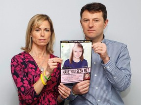 Kate and Gerry McCann are seen posing with a computer generated image of how their missing daughter Madeleine might look, during a news conference in London in this May 2, 2012 file photograph. On Monday the BBC's Crimewatch program will air a new appeal to help find Madeleine McCann who went missing from a holiday villa in southern Portugal in May 2007.  (REUTERS/Andrew Winning/Files)